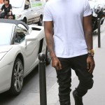 Styling On Them Lames: Kanye West Wearing $545 Balenciaga Arena Black Sneakers, Pants & White Tee-Shirt