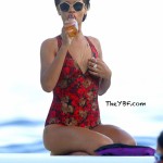 Still Vacaying In The French Riviera: Rihanna & Her Floral Swimsuit Spotted Drinking A Corona On A Yacht  