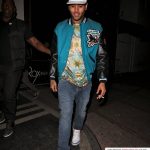 Chris Brown Leaving Roxbury Nightclub In A San Jose Sharks Varsity Jacket & Chiron London ‘High of Gods II Tee-Shirt