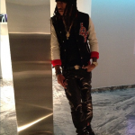 Rapper Future Wearing A $200 Joyrich The Joy Performer Varsity Jacket & Air Jordan Retro 4 “Bred” sneakers