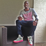 Chad Ochocinco In A $175 “Maison Kitsuné Paris New York Andre” Sweater & $1,140 Kanye West For Louis Vuitton-Jasper’s