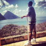 Victor Cruz Vacaying On The Island Of Saint Lucia In $295 Burberry Check Swim Shorts & Air Jordan 1 Mid Sneakers 