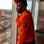 Rapper Rocko Shines Bright In An Orange Y-3 Jogging Suit