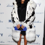 June Ambrose Wears A Fur Coat, Brian Atwood Sandals & Carries A Tom Ford Clutch 