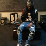 Wale Spotted In A Saint Laurent Black Teddy Bomber Jacket, Amiri Jeans & Nike Dunk High Pro SB “Unkle” Sneakers