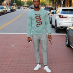 NFL Style: Tyrod Taylor In A Gucci Snake Jacquard Wool Sweater, Zara Trousers And Common Projects Sneakers