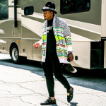 NFL Style: Cam Newton In A LNZ Clothing Retro Salmon Cardigan, Givenchy Black Distressed Logo Tee-Shirt & Versace Medusa Lace-up Sneakers