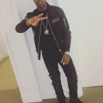 Lil Durk Wears A Pair Of  Saint Laurent Leather-Detail Moto Zip Jeans & Gucci Suede Boots With Web