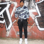 DJ Boof Wears A Sandro Paris ‘Warfare’ Sweatshirt