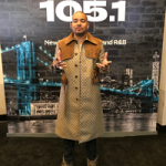 DJ Envy Outfitted In A Gucci GG Supreme Trench Coat & adidas Originals Yeezy Boost 750 Sneakers