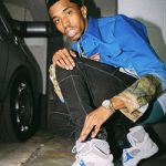 Passion For Fashion: Christian Combs Wears A Calvin Klein Jeans Est. 1978 Flag Print Denim Jacket And Chanel Tweed CC Sneakers
