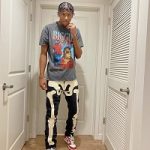 Jalen Green Sports An Urban Outfitters Biggie ‘The What’ Vintage T-Shirt, MNML D184 Skeleton Denim Jeans And Nike Dunk Low University Red Sneakers