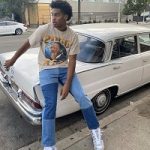 Joshua Christopher Outfitted In A Vintage Martin Luther King Jr. T-Shirt And Nike Air Rubber Dunk Off-White UNC