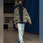 Shai Gilgeous-Alexander Dressed In A R13 Green Distressed Camouflage Hooded Field Jacket And Vlone x Endless Embroidered & Distressed Denim Jeans