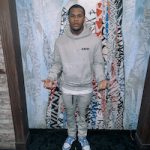 Devin Haney Outfitted In An Amiri Army Paint Hooded Sweatshirt And Gray Cotton Jogging Pants