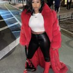 Remy Ma Bundled-Up In A Floor Length Fox Fur, Off-White Logo Print Cropped T-Shirt And Givenchy Shark Lock Boots
