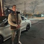 Gianni Paolo Posed In A Burberry Check Down-filled Puffer Gilet, Amiri Plaid Bandana Thrasher Jeans And Air Jordan 11 Retro Cool Grey 2021 Sneakers
