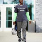 Football Player Siran Neal Wears A Balenciaga WFP T-Shirt And Lace-Up Runner Sneakers